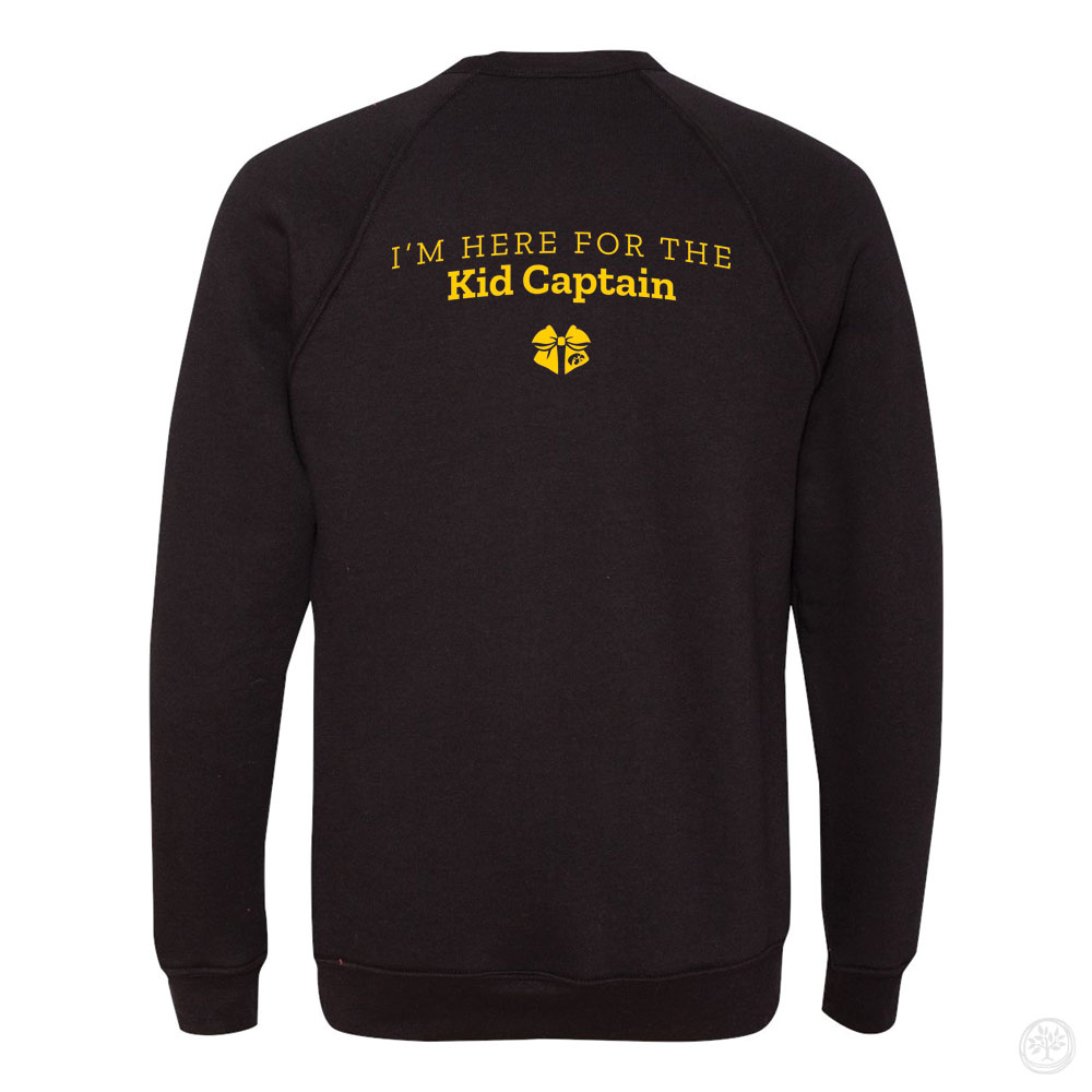 Back view of a black crewneck sweatshirt with yellow text reading ‘I’m Here for the Kid Captain’ and a small Kid Captain logo beneath it.