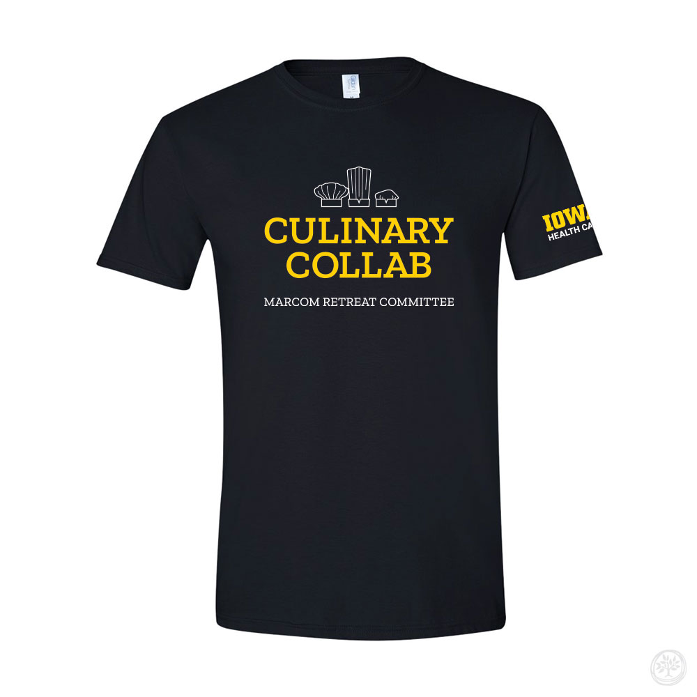 Black t-shirt with yellow text reading ‘Culinary Collab’ and white text below saying ‘Marcom Retreat Committee,’ featuring chef hat graphics above. The Iowa Health Care logo is printed in yellow on the sleeve.